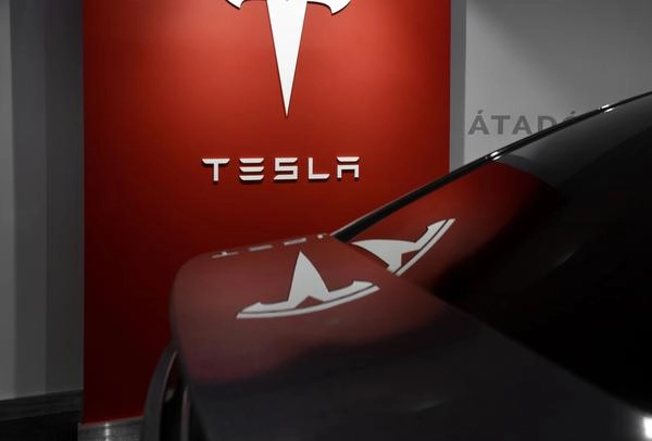Tesla logo inside a Tesla car dealership