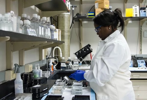 African American woman researcher in laboratory