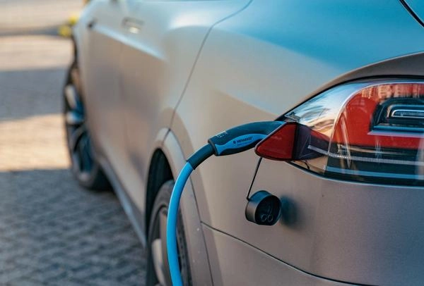 Grey Tesla electric car charging