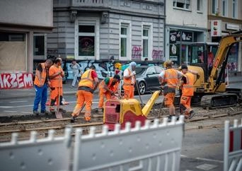 Construction workers repairing a train track