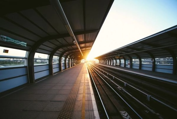 Sunset shining on train station